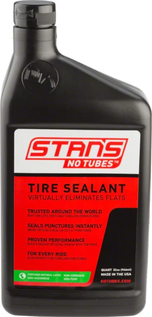 A bottle of STAN'S NOTUBES tire sealant on a white background.