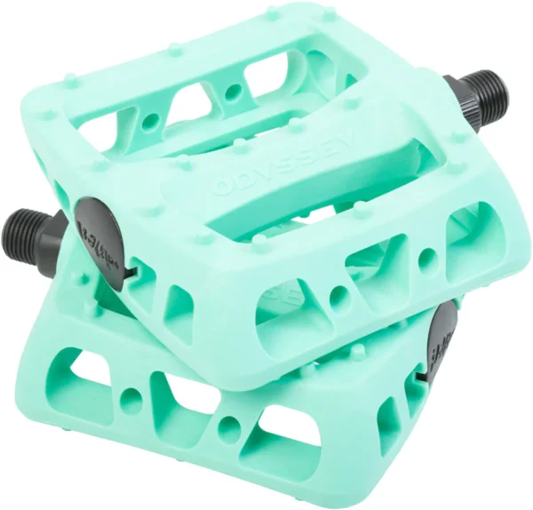 A pair of green ebike pedals on a white background.