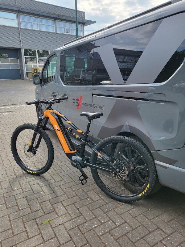 The Blackhawk Special parked in front of a van.