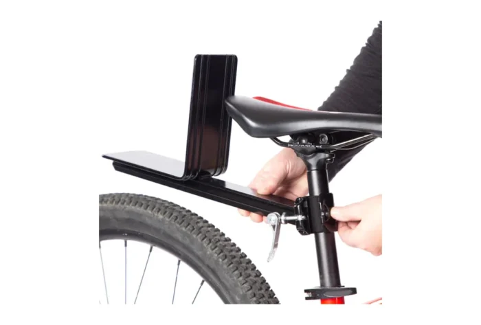 A person holding a K&H REAR RACK SEATPOST MOUNT FOR PET BASKET.