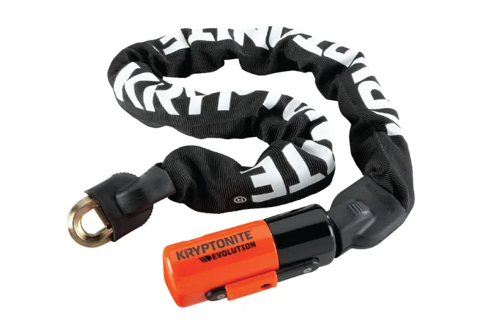 A black and orange Kryptonite Evolution 1090 Integrated Chain Lock with an orange handle, perfect for Ebikes.