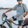 An older man on a LEVEL.2 Commuter Ebike, riding through the streets of WA, USA.
