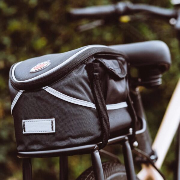 A black AVENTON REAR RACK - PACE 350 / PACE 500 bicycle with a black bag on the seat, perfect for cycling enthusiasts in the USA.