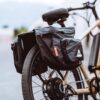 An e-bike with an AVENTON REAR RACK - PACE 350 / PACE 500 attached to it.