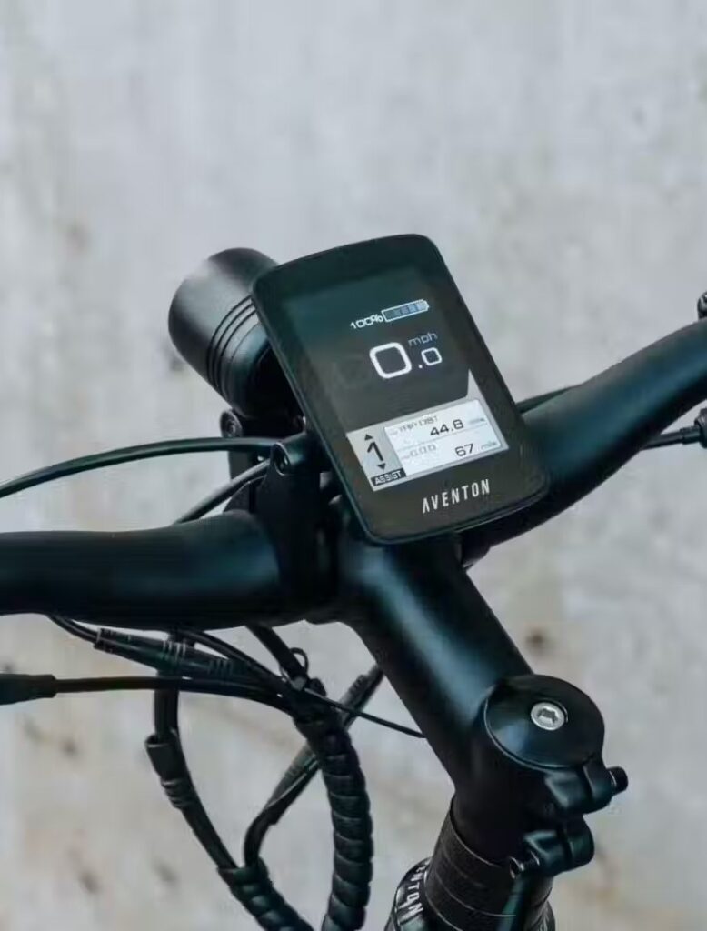 The handlebar of an ebike with a digital display and e-bikes accessories.