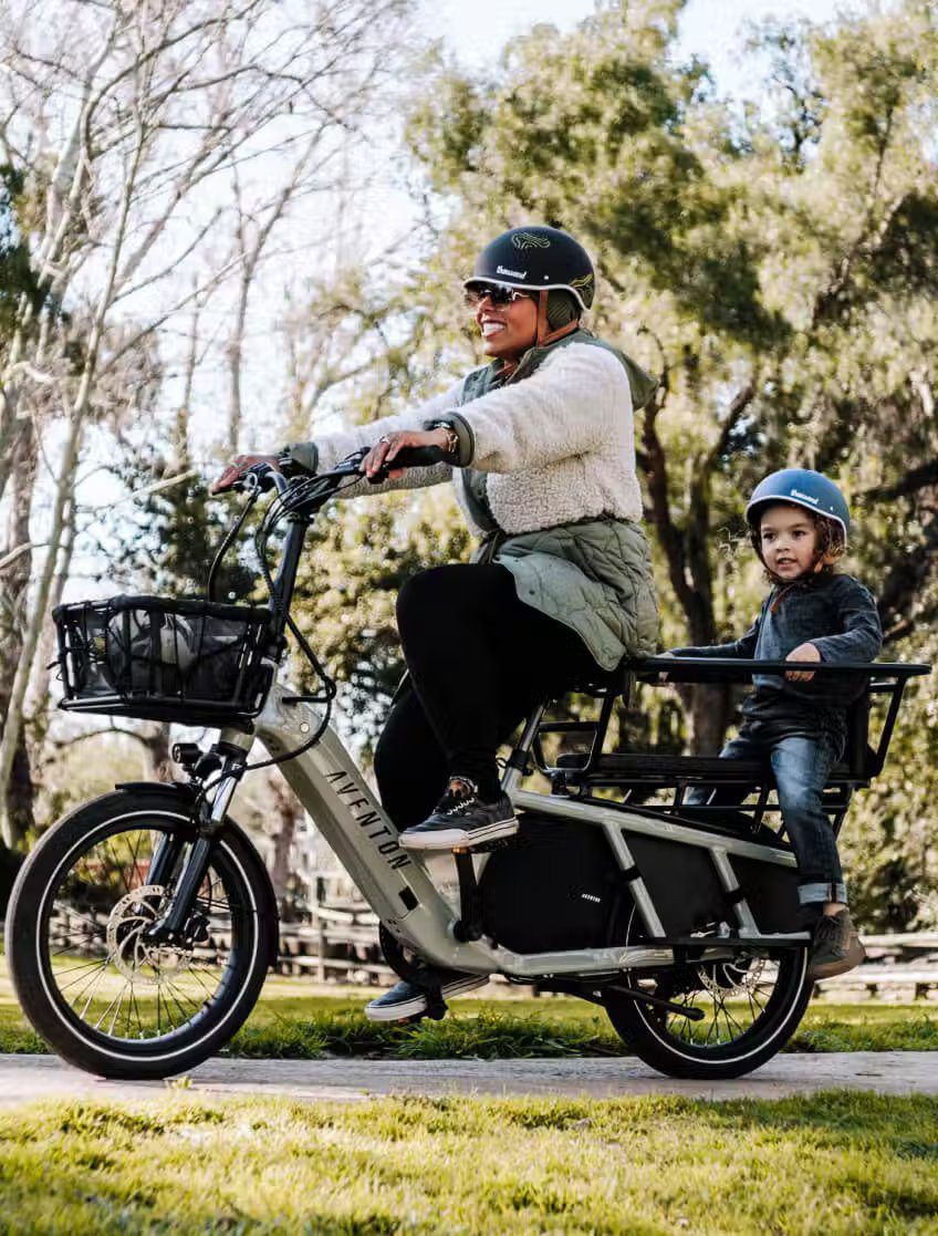 A woman and a child riding on an electric bike in WA, USA.