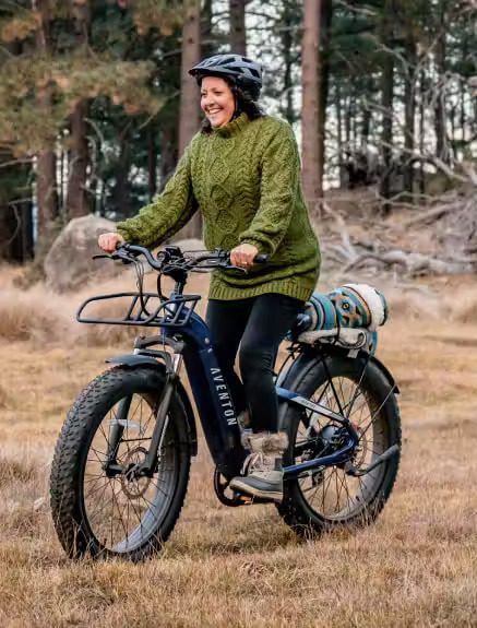 A woman riding an ebike in the woods of WA, USA.