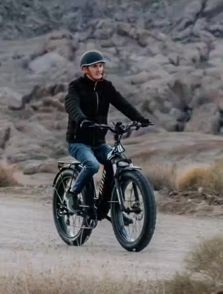 A man riding an electric bike in the USA desert.