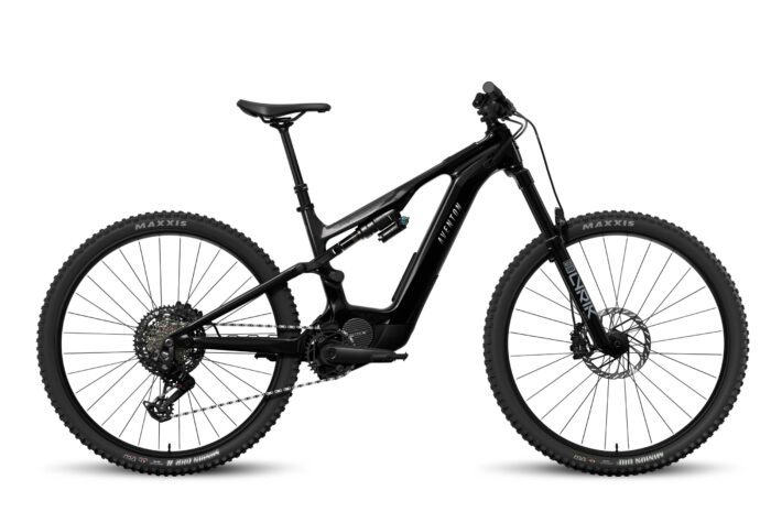 A black full-suspension electric mountain bike with thick tires, a central battery, and a sturdy frame, photographed from the side on a white background.