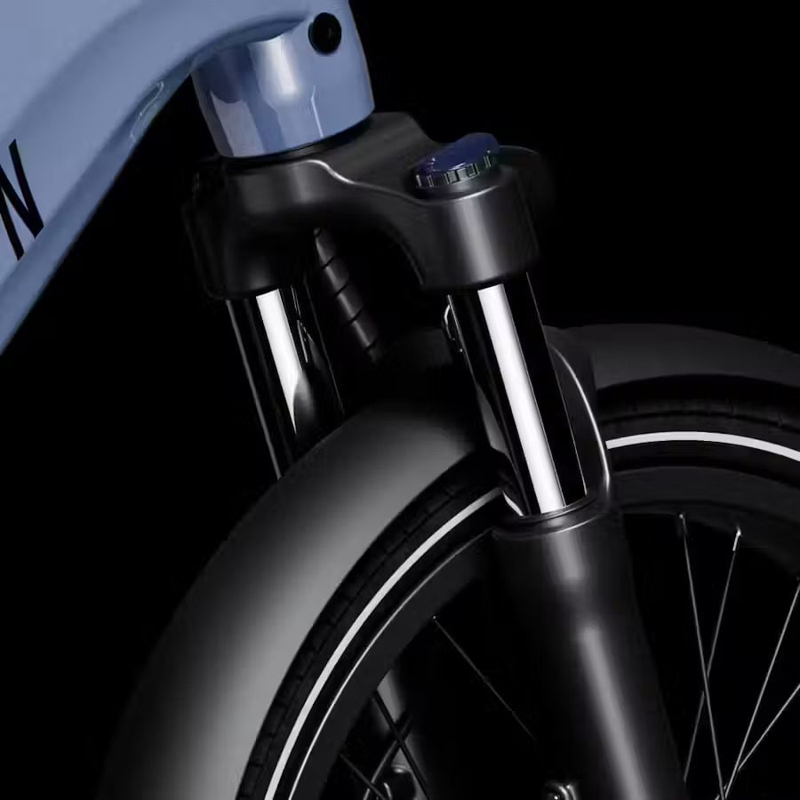 A close up of the front of a blue e-bike.