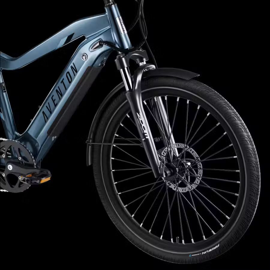 A blue electric bike is shown against a black background in the USA.