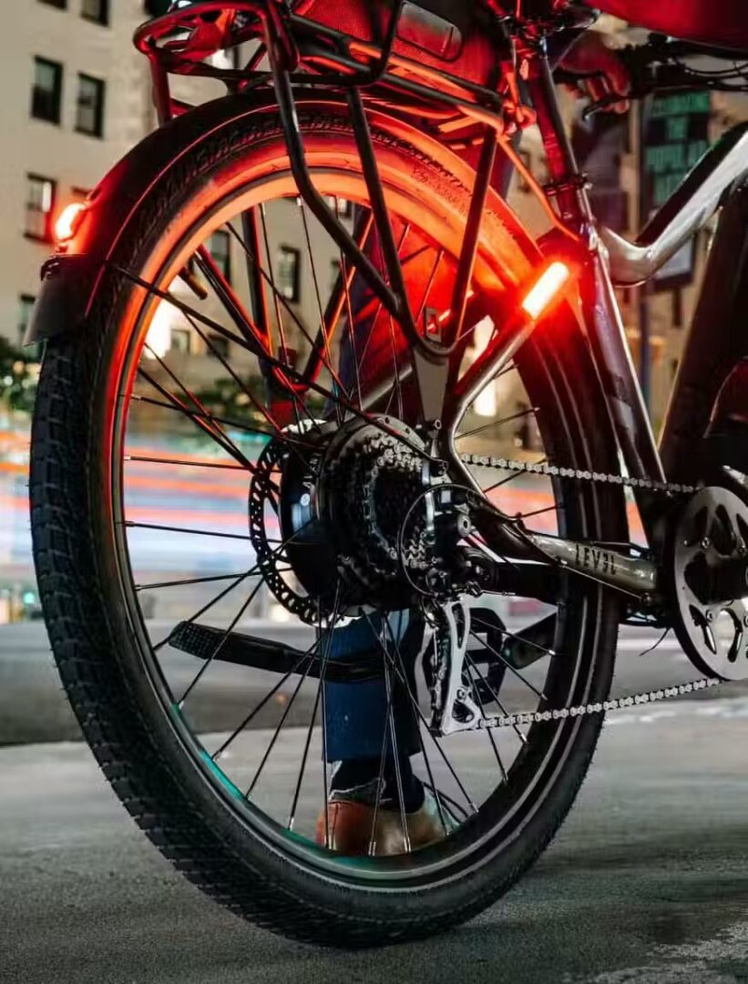 A person is riding an e-bike at night in the USA.