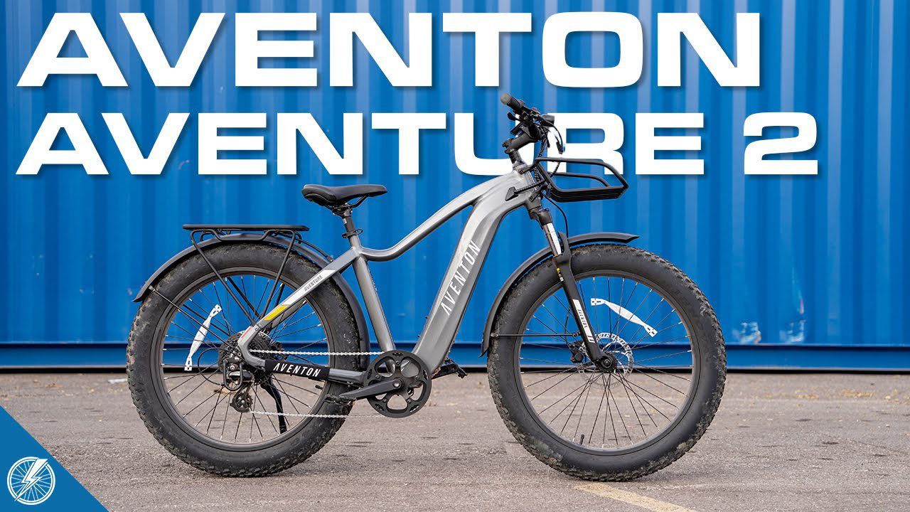 The aventon adventure 2, an ebike, is parked in front of a blue container in the USA.