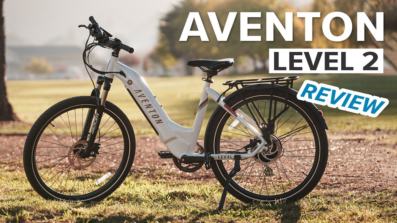 A white bike with the words Aventon Level 2 review, featuring ebikes and e-bikes accessories.