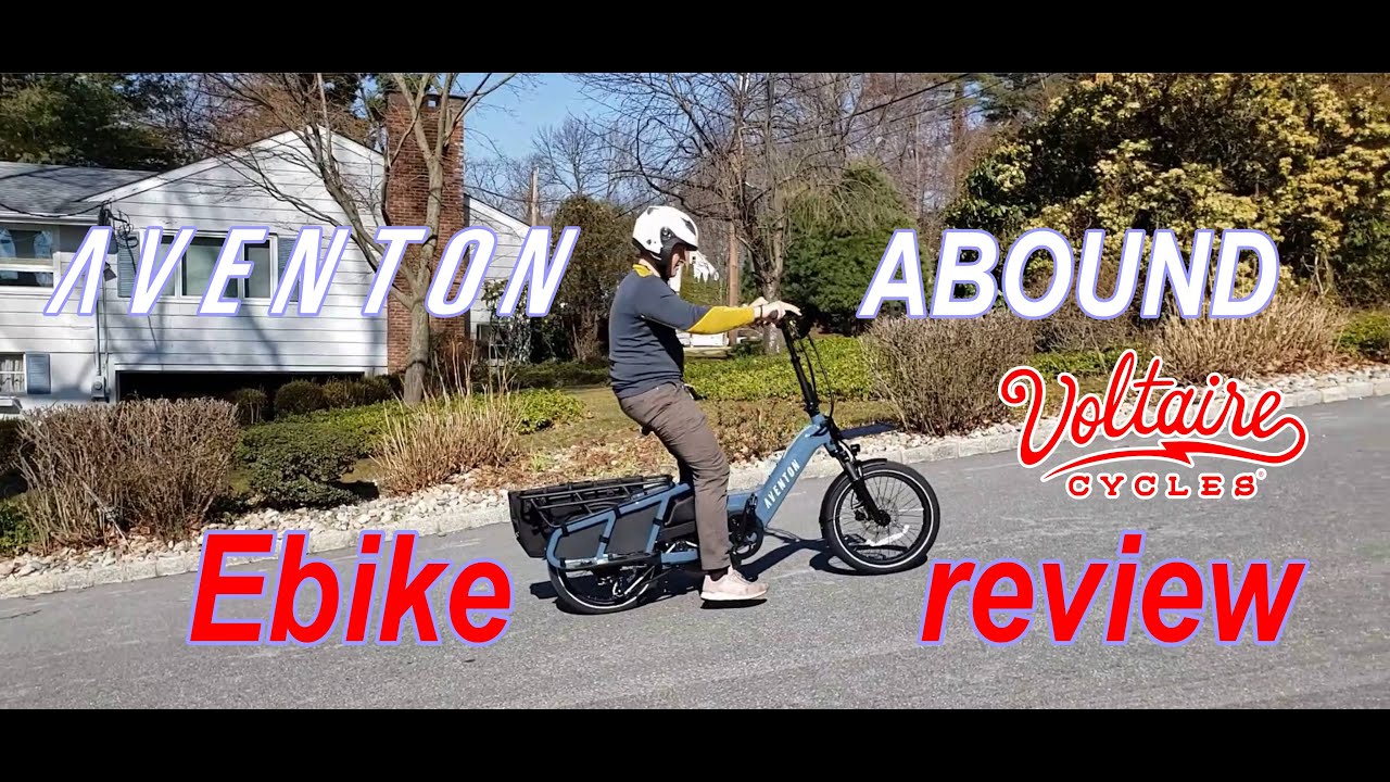 A person riding an ebike with the words allen around ebike review in the USA.