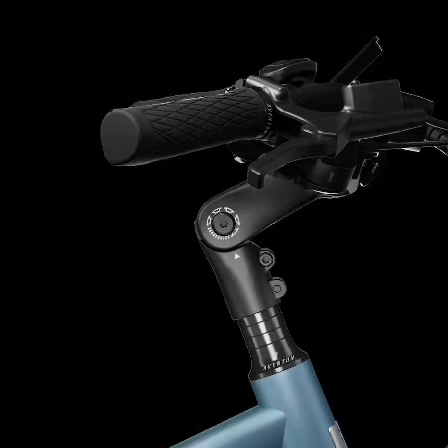 A close up of the handlebar of a blue bicycle featuring Ebikes accessories.