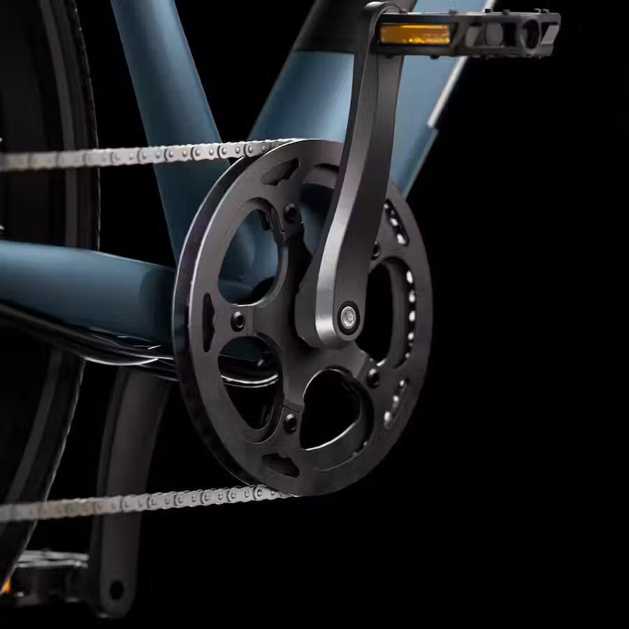 A close up of a bicycle chain with e-bikes accessories.