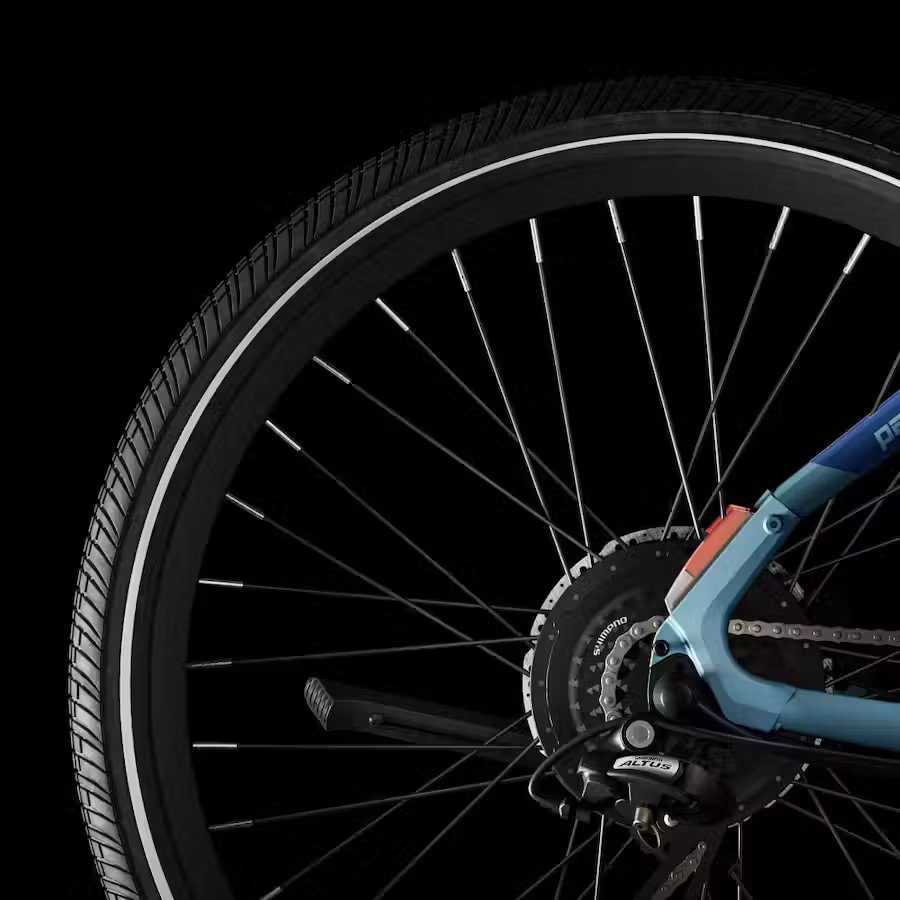 A close up of a bicycle wheel on a black background, showcasing the latest accessories for e-bikes.