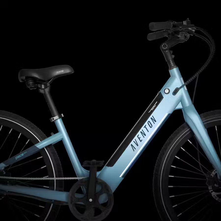 A blue electric bike is shown against a black background, highlighting its sleek design and powerful performance.