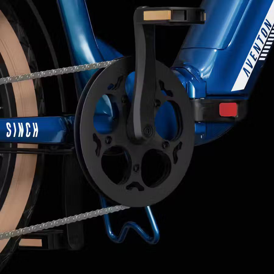 A close up of a blue electric bike with a chain.