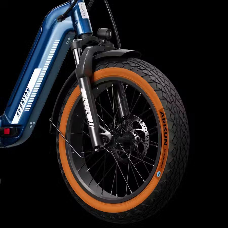 A blue and orange electric bike with a tire, perfect for USA riders seeking Ebikes and e-bike accessories in WA.