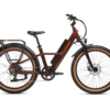 A maroon electric bicycle with a black frame, wide tires, front and rear fenders, and a rear cargo rack. The bike features a battery integrated into the frame.