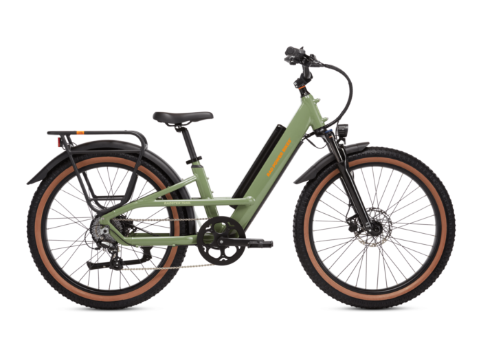 Green electric bicycle with a step-through frame, wide tires, front suspension, rear rack, and handlebar display, shown from the side against a white background.