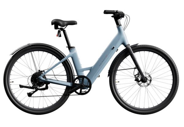 The Carbon 1 Step-Thru is a matte grey electric bicycle featuring a low-step frame, black handlebars, black wheels, a rear fender, and visible chain gear.