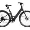 A matte black electric bicycle with thick tires, a step-through frame, and disc brakes, shown in side view on a white background.