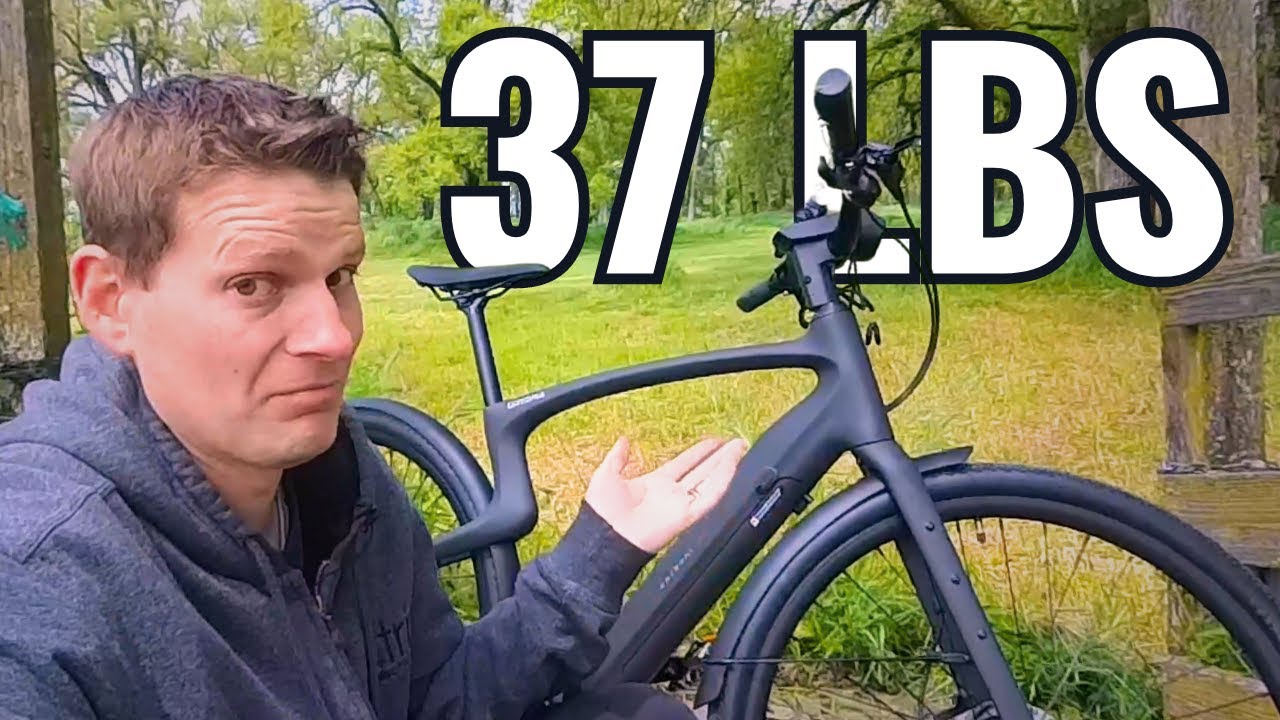 A person wearing a gray hoodie shrugs next to a black bicycle, with "37 lbs" written in large text above.