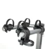 A close-up view of the Beta™ bike rack featuring four adjustable plastic straps and padded holders for securing bicycles.