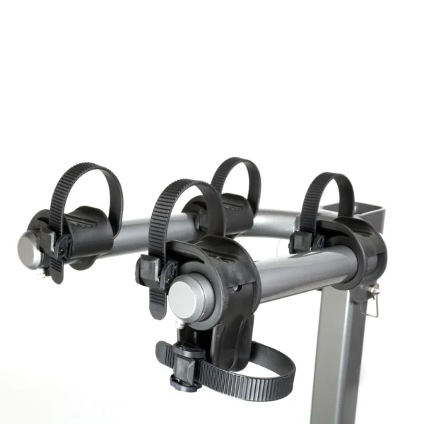 A close-up view of the Beta™ bike rack featuring four adjustable plastic straps and padded holders for securing bicycles.