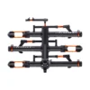 A side view of the black and orange NV™ 2.0 Add-On bike rack, featuring four trays for bicycles, displayed against a white background.