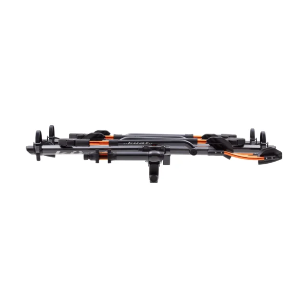 A folded NV™ 2.0 Add-On hitch-mounted bike rack in black and orange is displayed on a white background.