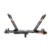 The NV™ 2.0 Add-On is a two-bike platform hitch rack, featuring black and orange accents, displayed from the side with upright support arms extended.