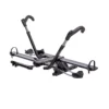 The NV™ 2.0 is a black, hitch-mounted bike rack with adjustable arms and wheel holders, designed to carry two bicycles.