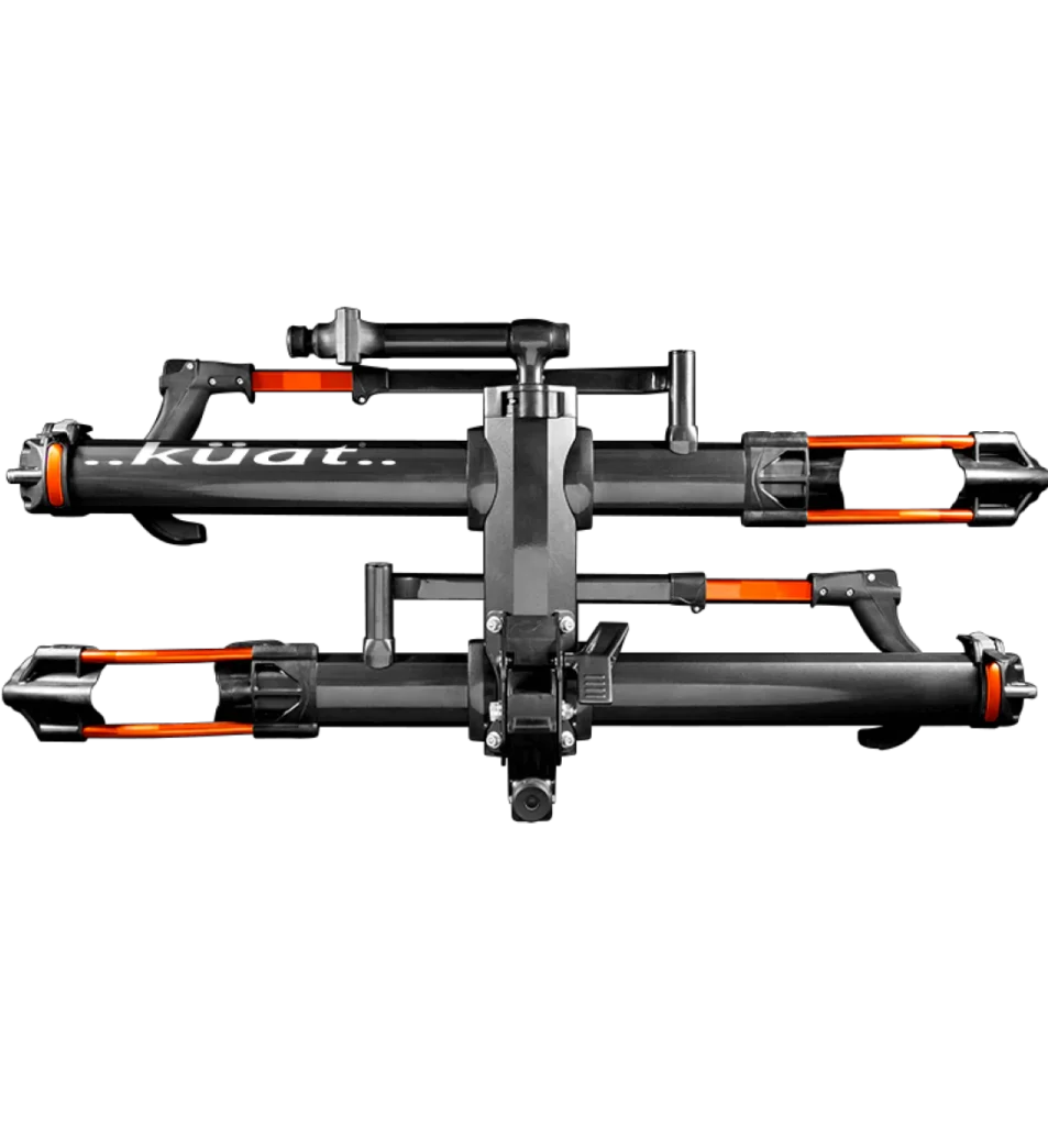 Black Kuat bicycle rack with orange accents, shown folded against a black background, displaying its sturdy frame and compact design.