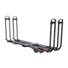 The Piston® Pro X is a black metal hitch-mounted bike rack with four upright arms designed to secure bicycles at the rear of a vehicle.