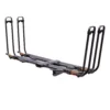 The NV™ 2.0 Add-On is a black metal hitch-mounted bike rack with adjustable arms, designed to carry four bicycles. It’s shown against a white background.