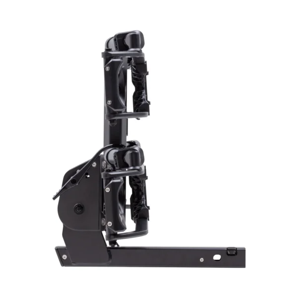 The Piston® Pro X bike rack, black with two cradles, is shown from the side highlighting its metal frame, adjustable arms, and mounting bracket.