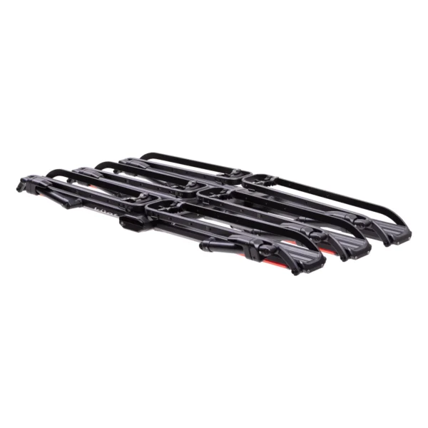 The Piston® Pro X is a black metal bicycle rack designed to hold multiple bikes, shown folded flat on a white background.