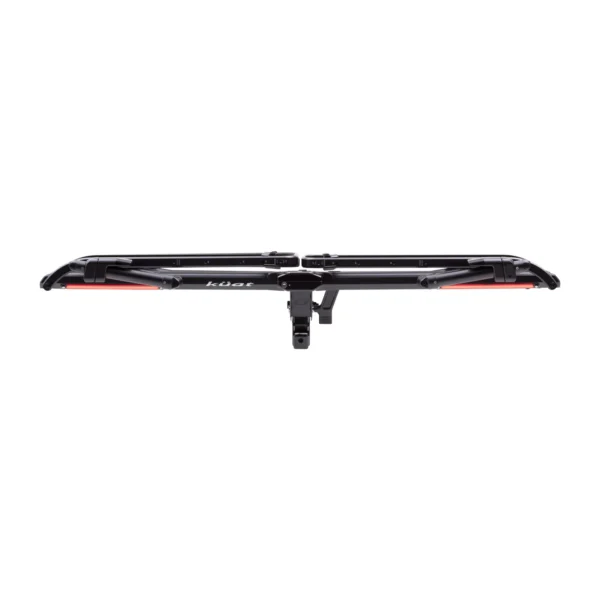 The Piston® Pro X, a black metal hitch-mounted bike rack, is shown from the rear with two parallel wheel trays and red reflectors on each end.
