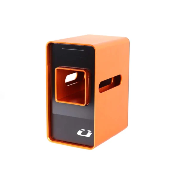 A rectangular orange and black metal object with a square cutout and side handles, featuring a white logo on the front.