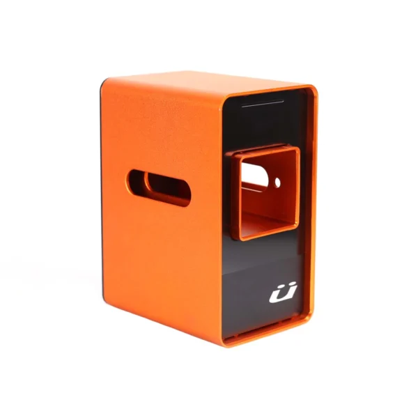 The Rack Dock is a rectangular orange metal object with a cut-out slot, a smaller inner compartment, and a white stylized "u" logo on a black base.