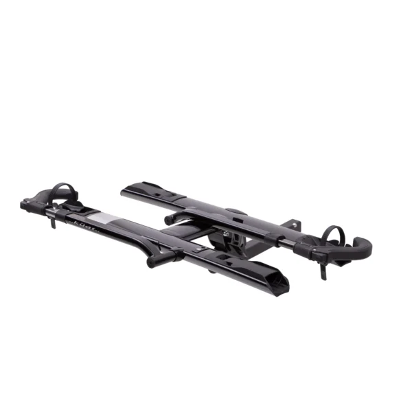 The Sherpa™ 2.0 is a black metal platform-style bike rack featuring wheel holders and locking mechanisms, designed for mounting on your vehicle’s rear hitch.