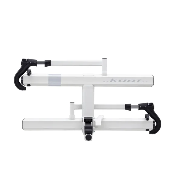 The Sherpa™ 2.0 bicycle rack features a white minimalist design with black hooks, displayed against a plain white background.