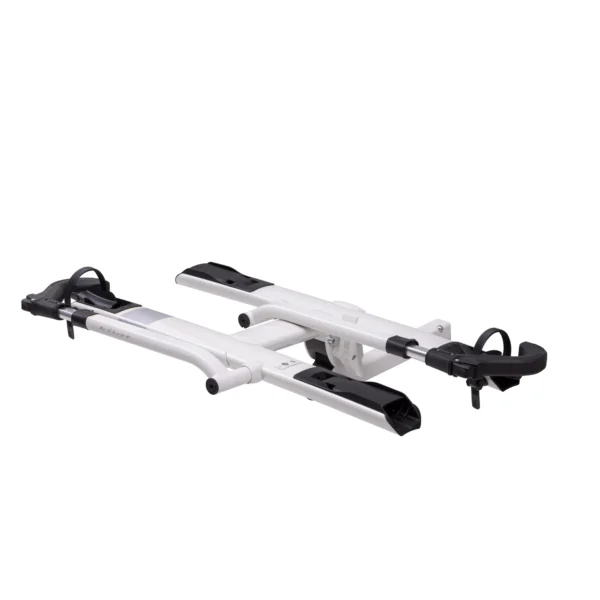 The Sherpa™ 2.0 is a white and black bicycle rack with two wheel trays and adjustable arms, designed for mounting on a vehicle.