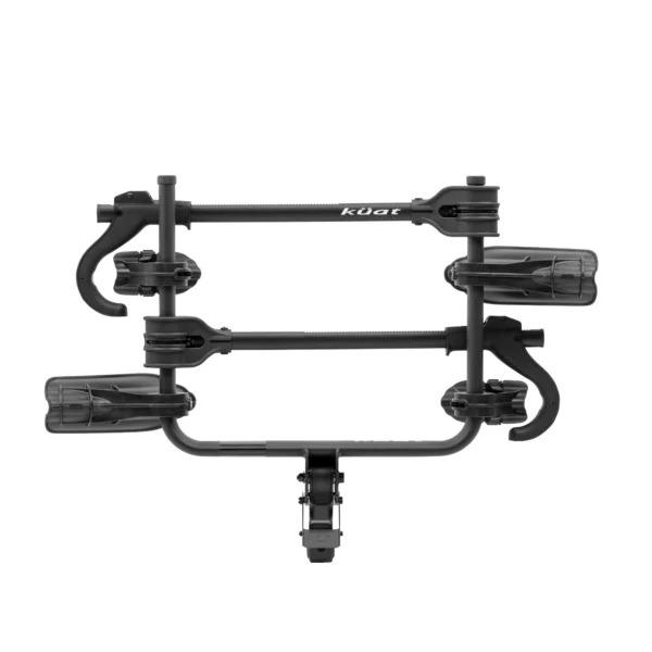 The Transfer™ v2 is a black Kuat hitch-mounted bike rack for two bikes, shown from above with padded wheel trays and adjustable arms.