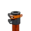 Close-up of a Tri Doc - Trail Doc Stand in black and orange, featuring a quick-release seatpost clamp attached to an orange seatpost, isolated on a white background.