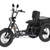 The Meet One Tour Lite Full Suspension Electric Trike features wide tires, upright handlebars, a front headlight, a cushioned seat with backrest, and a rear storage compartment.